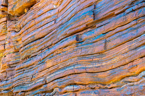 Layers of natural asbestos shining blue at Karijini National Park Australia