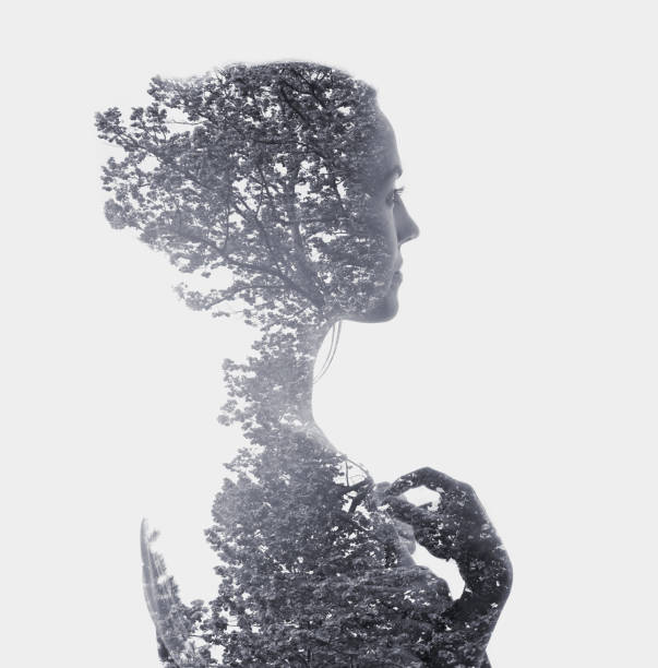 istock Multiple Exposure of young woman morphing into tree 1166446450