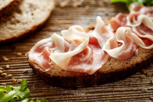 istock Ham sandwich, open faced sandwich with sourdough bread and ham on a wooden table 1166446637