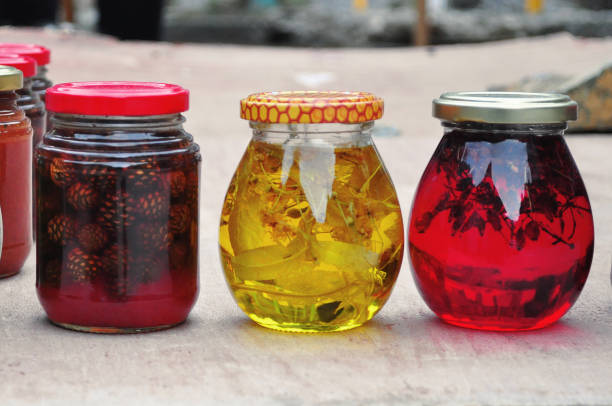 istock Multi-colored jars of red and yellow jam from linden and cedar cones 1166447088