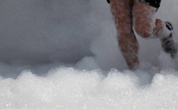 istock Bubble Run in Lowry Sports Park. Running legs close up. 1166448895