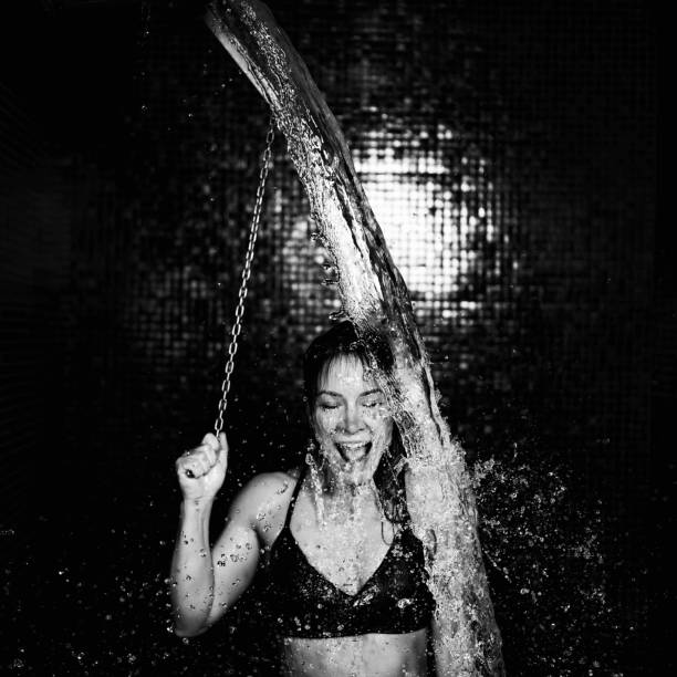 Woman in Wellness Center, Taking a Cold Shower From Ice Bucket After Sauna.