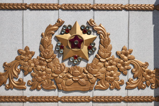 Mausoleum. Pyongyang, North Korea Pyongyang, North Korea - May 2, 2019: The gate decoration in Kumsusan Memorial Palace of the Sun. Mausoleum and tomb of Kim Il Sung and Kim Jong Il. kim il sung mausoleum stock pictures, royalty-free photos & images