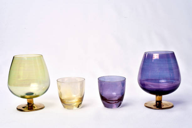 istock Colorful drinks glass cup on table on white background. 1166465776