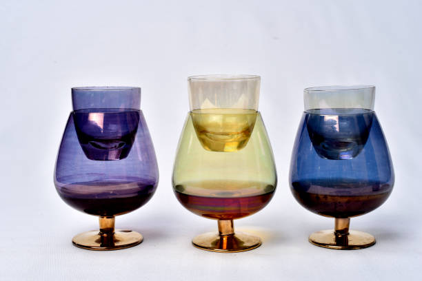 istock Colorful drinks glass cup on table on white background. 1166465927