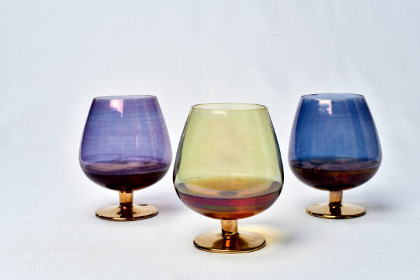 istock Colorful drinks glass cup on table on white background. 1166466028