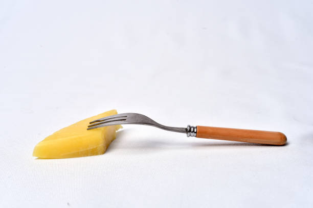 istock piece of cheese  on the table on white background 1166466161