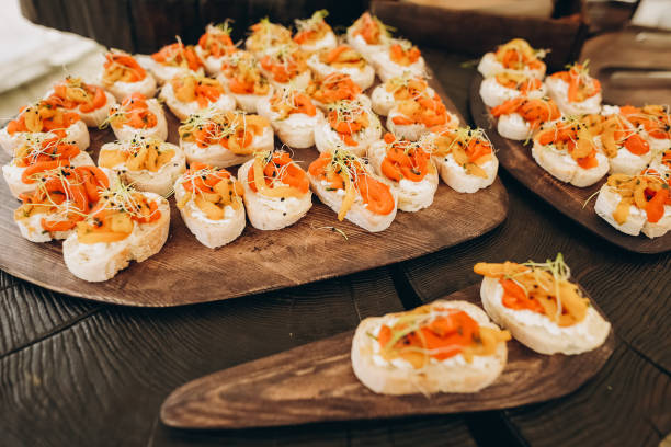 istock party corporate food buffet appetizers fish canapes 1166468579