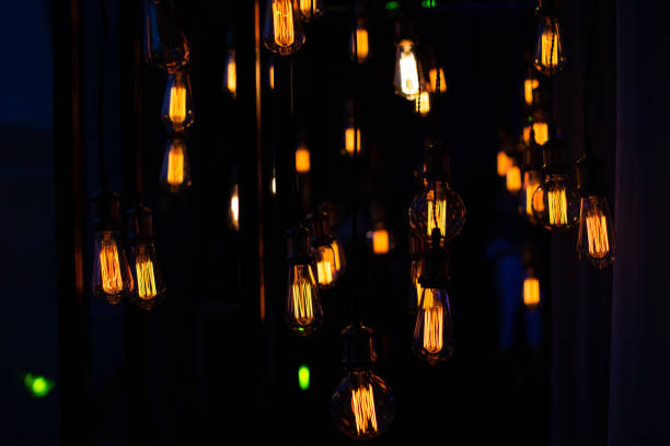 istock Edison lamps decorative group garland suspended wires 1166468616