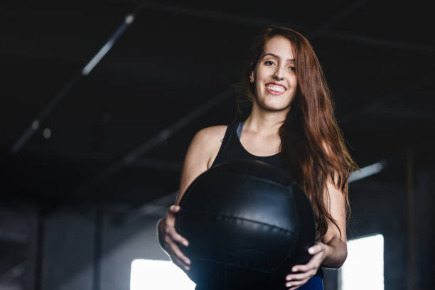 istock Young woman holding a training ball 1166468846