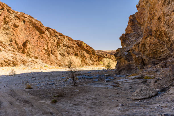 Several rocks at bottom of slot canyon near Radium Springs, NM