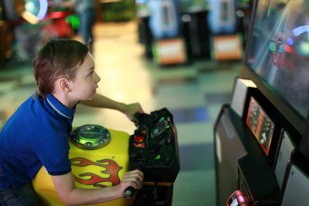 istock Boy playing motorbike simulator 1166470750