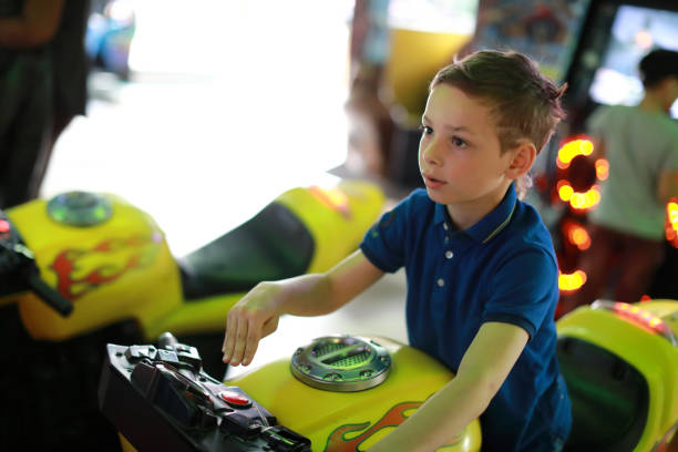 istock Child playing motorbike simulator 1166470751