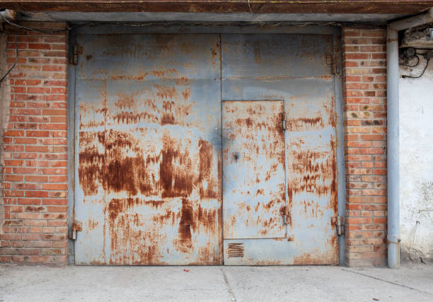 old metal door to the car garage