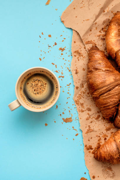 istock Coffee and croissant for breakfast, top view 1166474438
