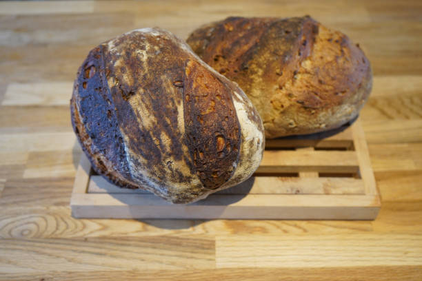 istock Freshly baked bread on a wooden cutting board 1166474505