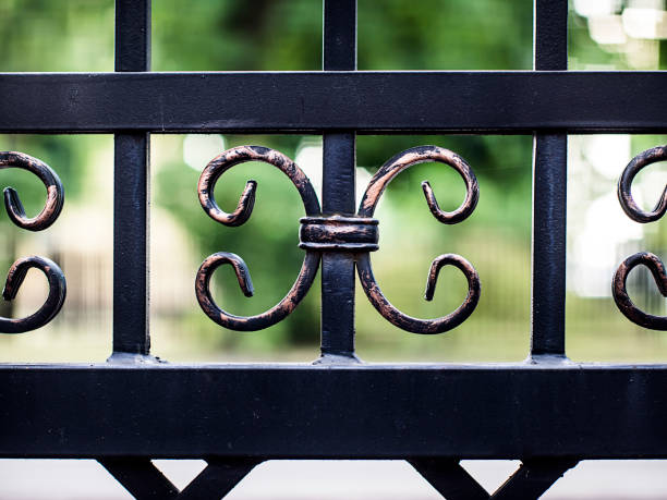 istock decorative elements of the fence on a background of greenery 1166474735