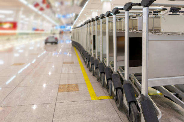 istock Trolley cart in a row at airport 1166474876