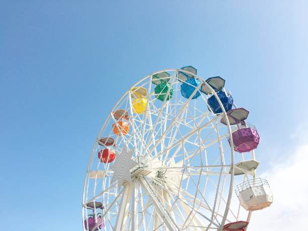istock White ferris wheel with colorful cabs 1166476348