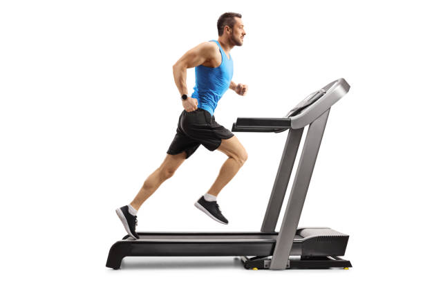 istock Young man in sportswear running on a professional treadmill 1166480396