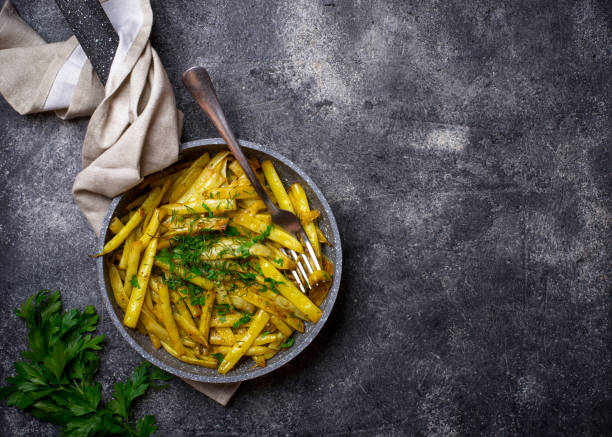 istock Stewed yellow wax beans in pan 1166480471