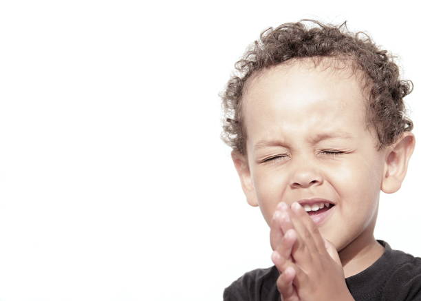 istock boy praying to God stock photo 1166482065