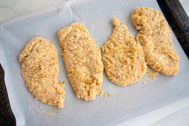 raw double breaded chicken cutlets - cutlet imagens e fotografias de stock