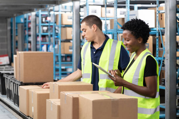 Conveyor Belt and Warehouse Workers stock photo