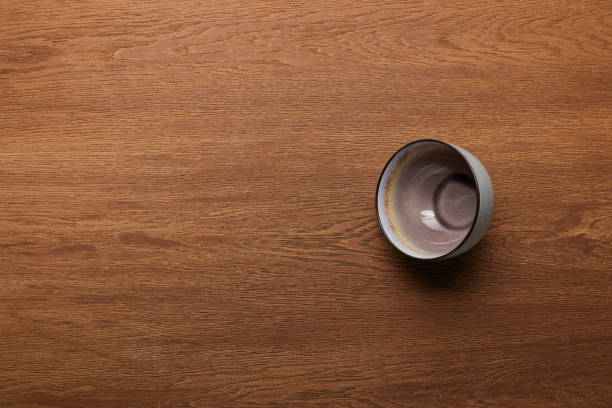istock top view of empty ceramic bowl at wooden table with copy space 1166483621