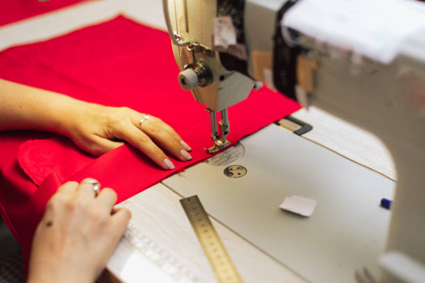 istock a tailor embroiders with a sewing machine on a crocheted fabric. 1166483885