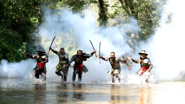 Slow Motion Ancient Warriors Running And Yelling To Fight With Enemy At The River