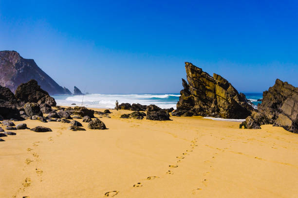 Sandy Adraga beach between rocks coastline of Atlantic ocean