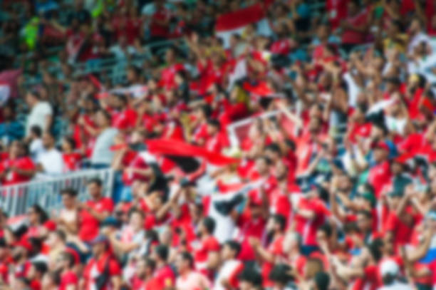 istock Blurred crowd of spectators on a stadium 1166486743