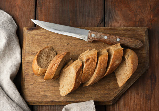 istock sliced rye flour baguette on a wooden cutting board 1166488345