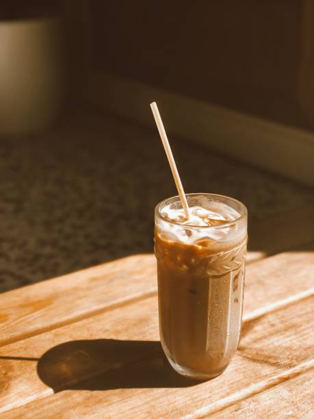 Ice coffee with milk on a sunny day stock photo