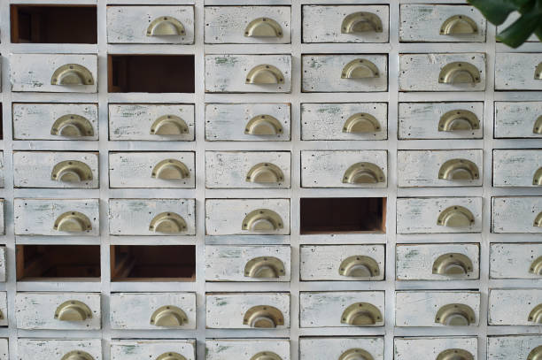istock White filing Cabinet in the old style.With missing drawers . Retro 1166489694