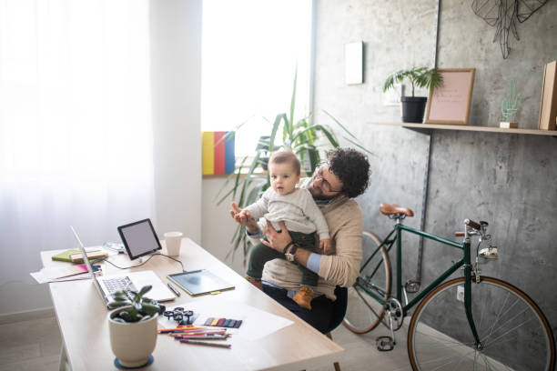 istock Freelancer dad working from home and looking after his baby boy 1166490009