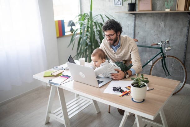 istock Father and son video chatting on laptop 1166490567