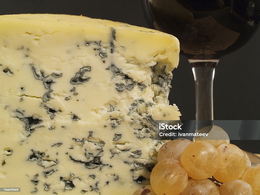 Blue Cheese And Wine on black Cheese still life Alcohol - Drink Stock Photo