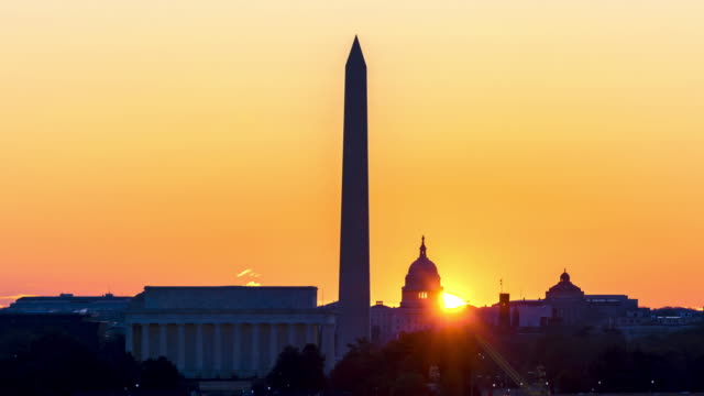 4K UHD Time Lapse : Sunrise over Lincoln Memorial, Washington Monument, and Capitol Building at Washington DC, United State.