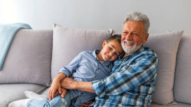 istock Grandpa and grandson are playing, hugging and smiling 1166496972