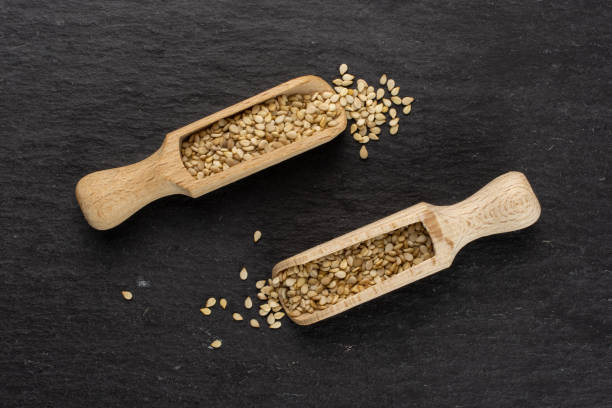 istock Unpeeled sesame seeds on grey stone 1166497116