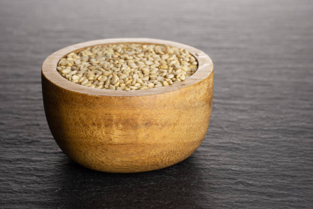 istock Unpeeled sesame seeds on grey stone 1166497117