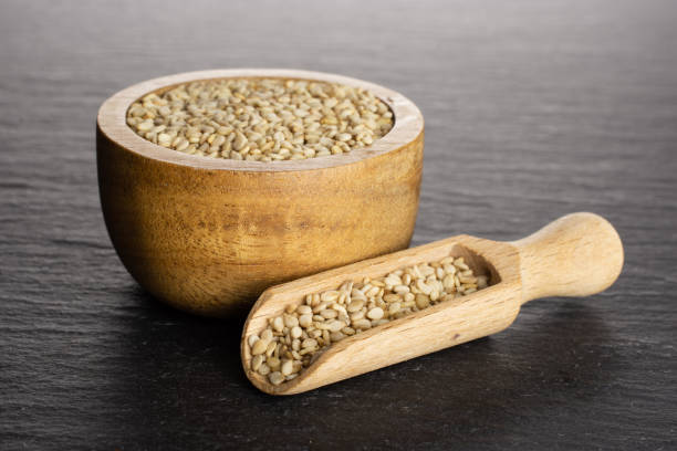 istock Unpeeled sesame seeds on grey stone 1166497122
