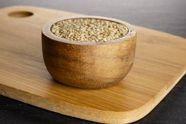 istock Unpeeled sesame seeds on grey stone 1166497126