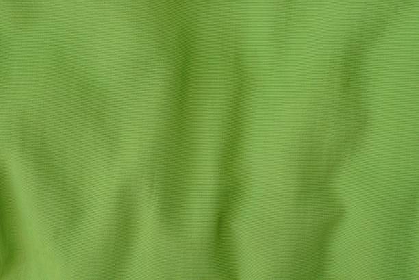 istock green fabric texture from a piece of crumpled clothes 1166497128