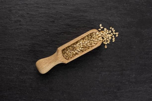 istock Unpeeled sesame seeds on grey stone 1166497129