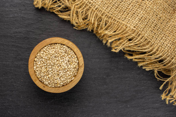 istock Unpeeled sesame seeds on grey stone 1166497130