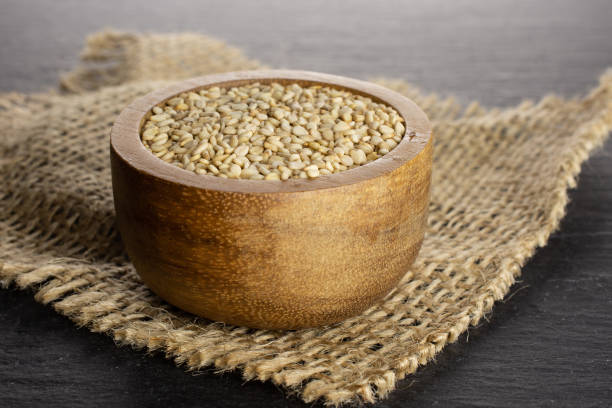 istock Unpeeled sesame seeds on grey stone 1166497140