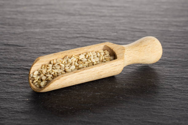 istock Unpeeled sesame seeds on grey stone 1166497141